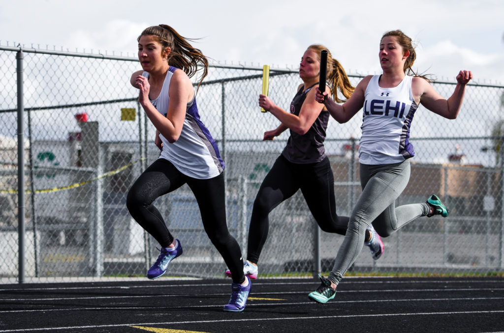 LHS track sprinters and sisters Brielle West and Caela West hand off the baton during a recent meet. Photo credit: Josh Hansen