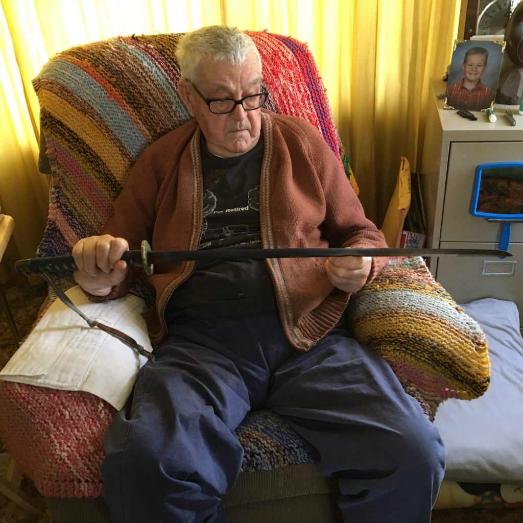 Victor Kolan holds Japanese sword.