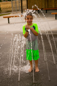 Ryan (7) loves getting sprayed by the water. Photo: Kaye Collins
