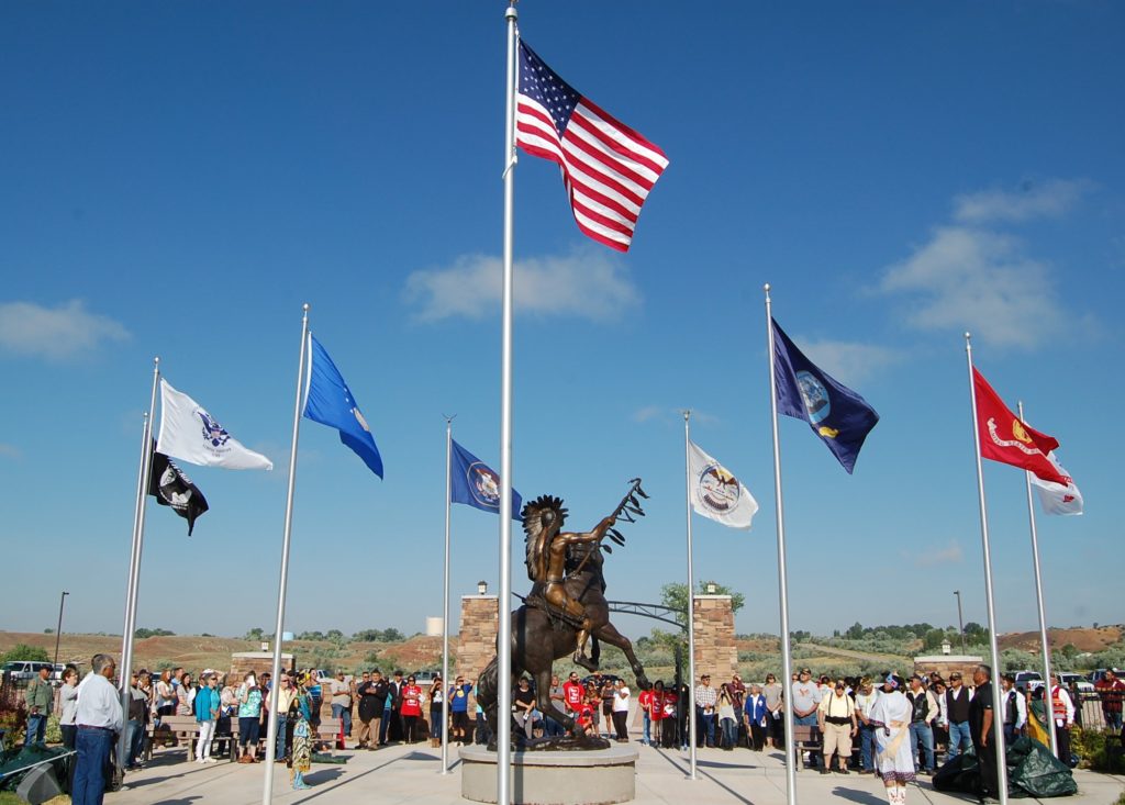 A crowd gathers to take part in the unveiling of Lehi native and artist Jerime Hooley’s 13-foot bronze statue “Ute Warrior Chief” during a ceremony held July 2, 2016. Photo courtesy of MaKay Hooley