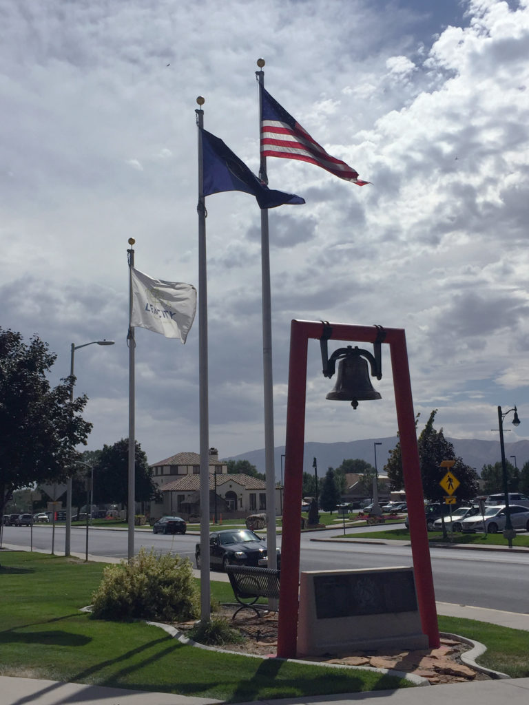 Historic fire bell and flags at LFD Station 81. Photo: Kaye Collins