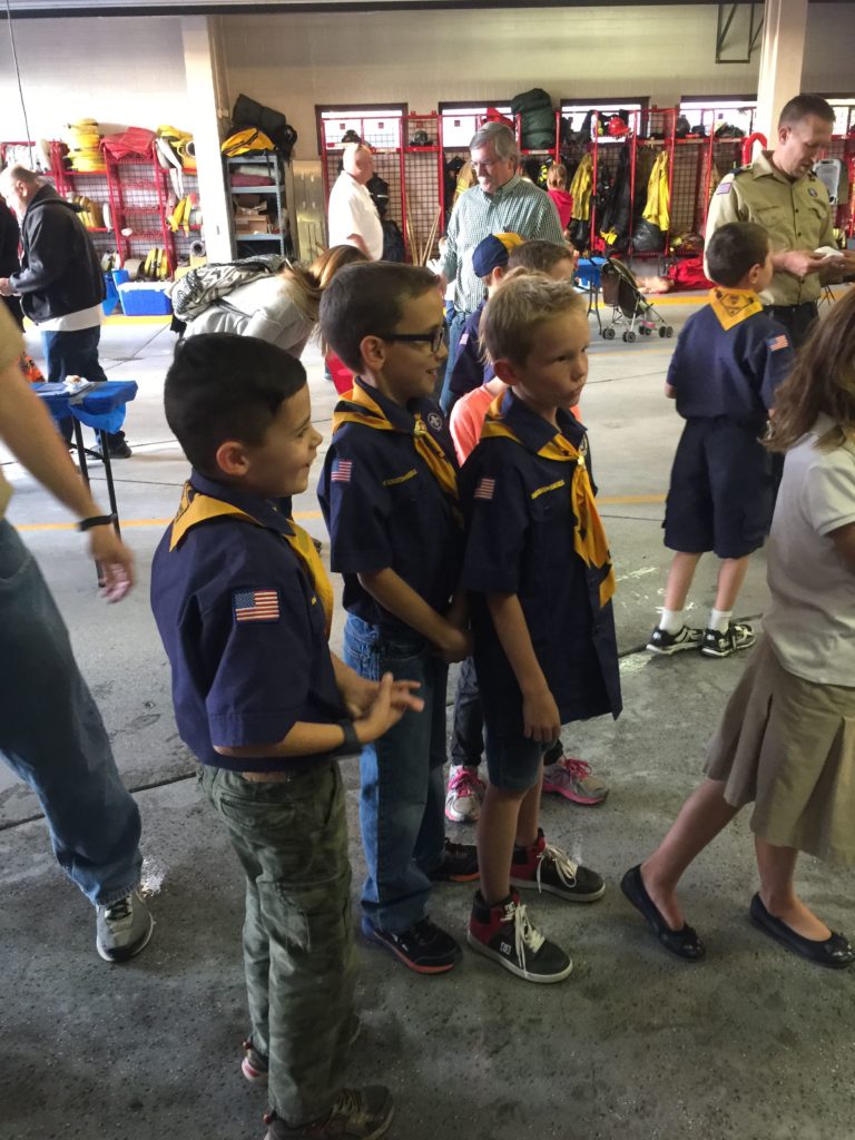 Cub Scouts from pack 1347 receive instruction about how to spray water at the bottom of flames to extinguish them. Photo: Kaye Collins